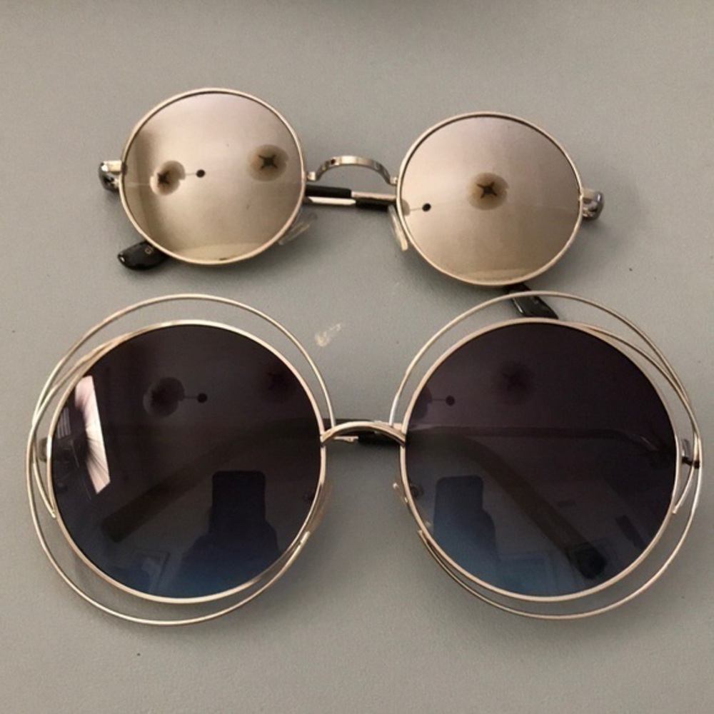 Bundle of 2 pairs of tinted round metal frame sunglasses.